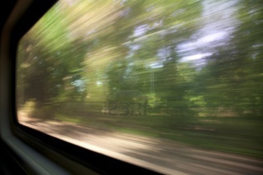 7765852-green-trees-a-blurred-window-view-from-a-train-in-motion